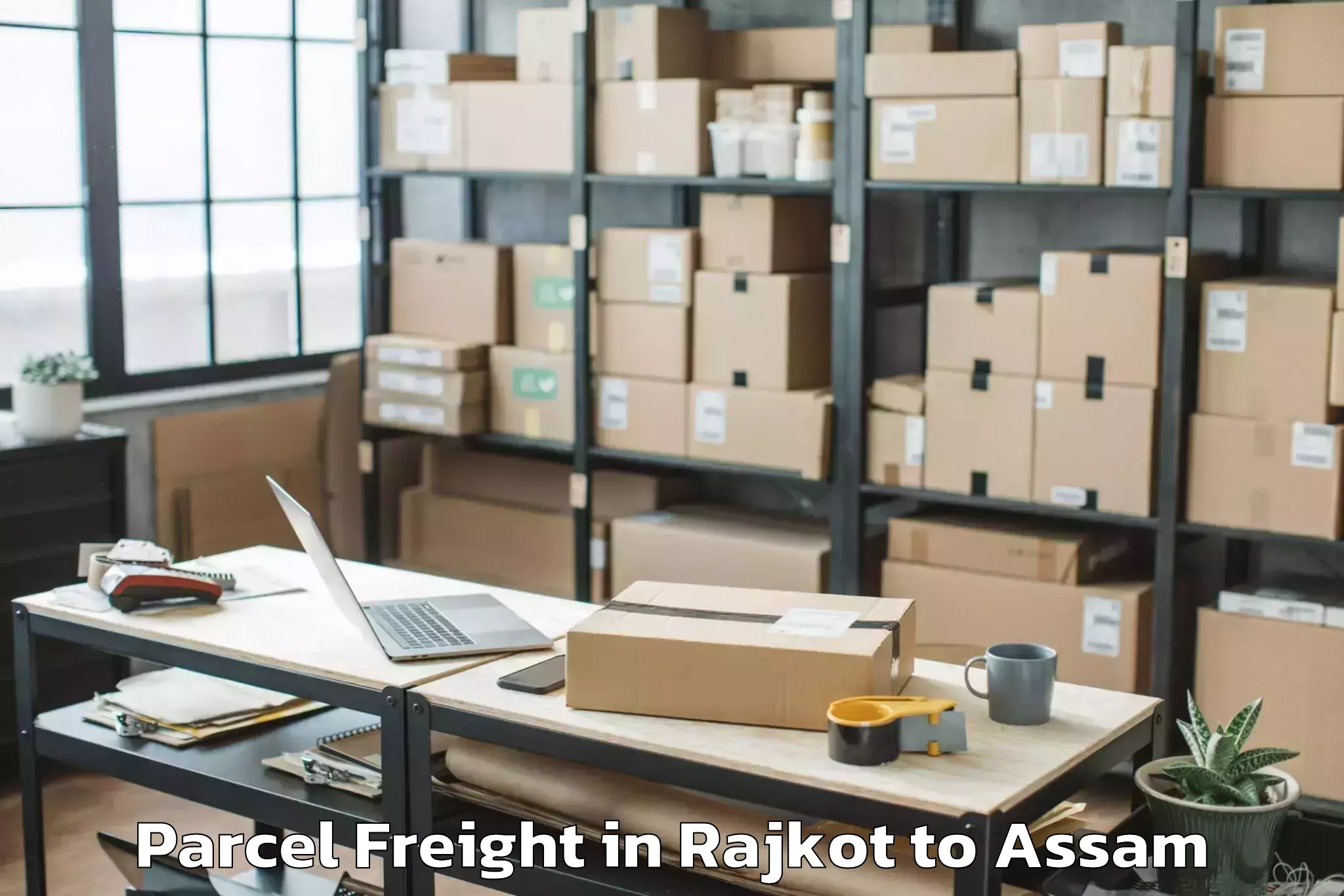 Book Rajkot to Rangia Parcel Freight Online